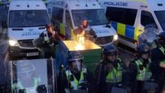 Two charged after clashes at Henry Nowak protests